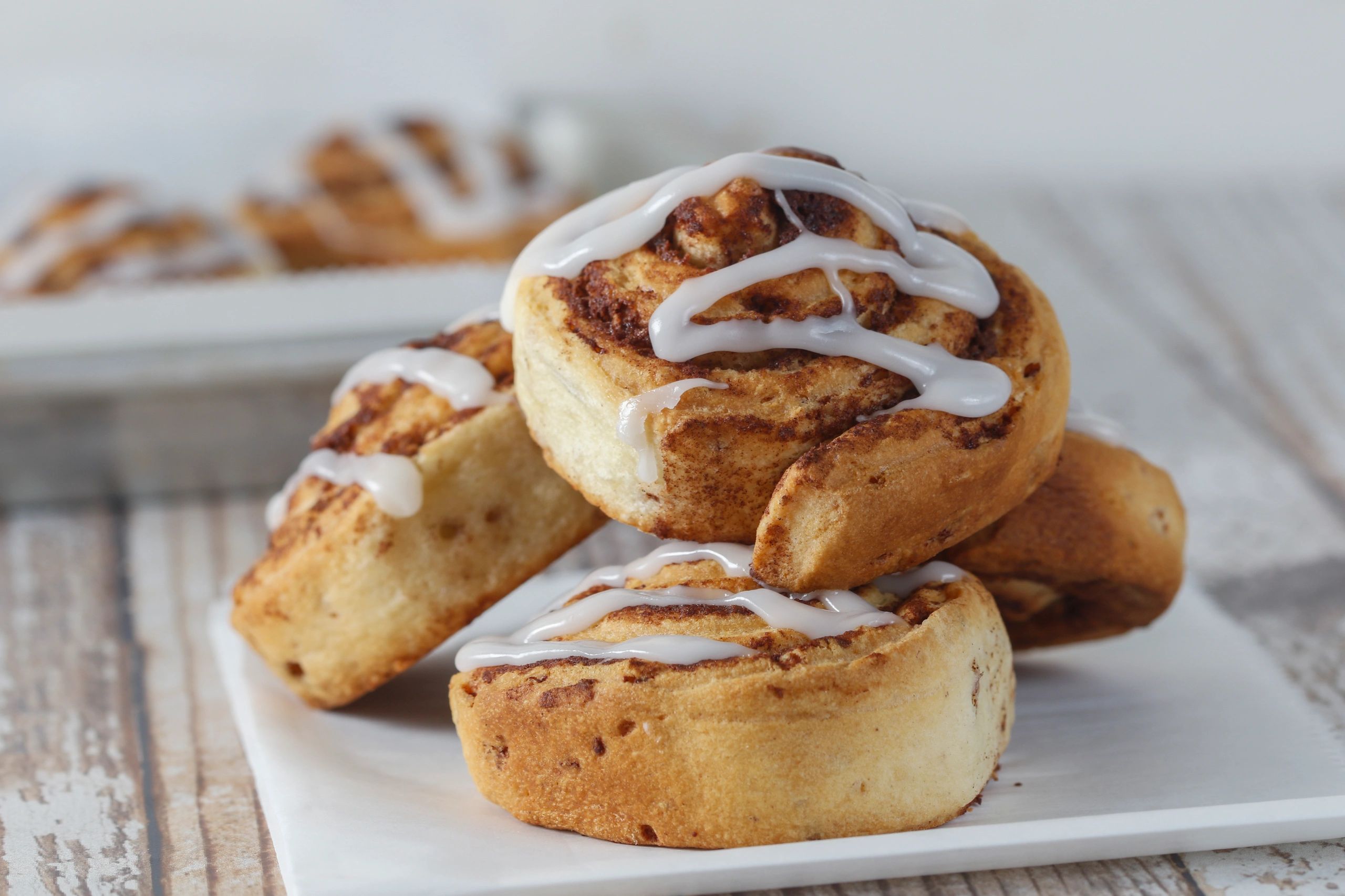 Cinnamon rolls topped with vanilla icing