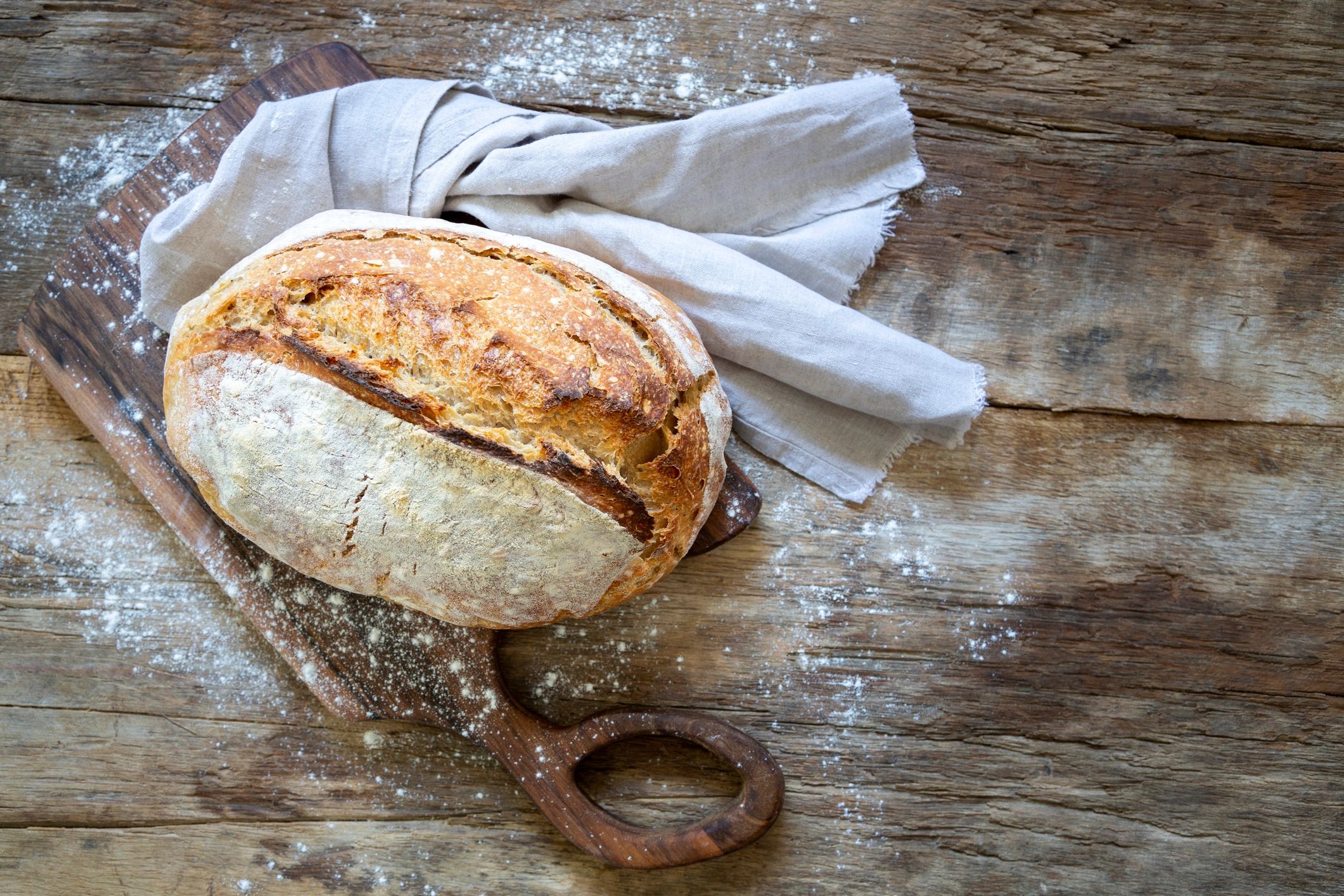 Rustic loaf of bread on a wooden table