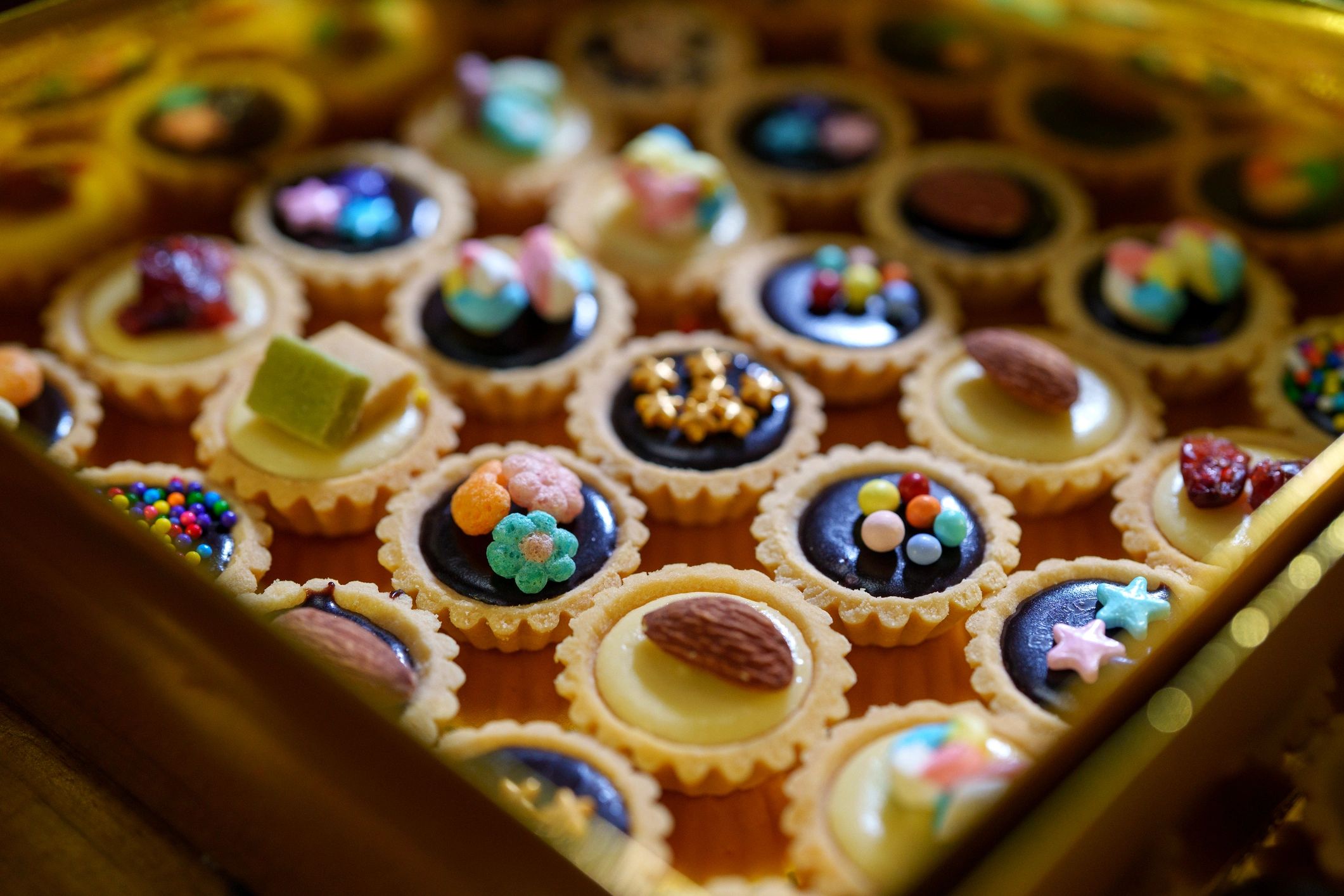 Assorted mini fruit tarts in a box