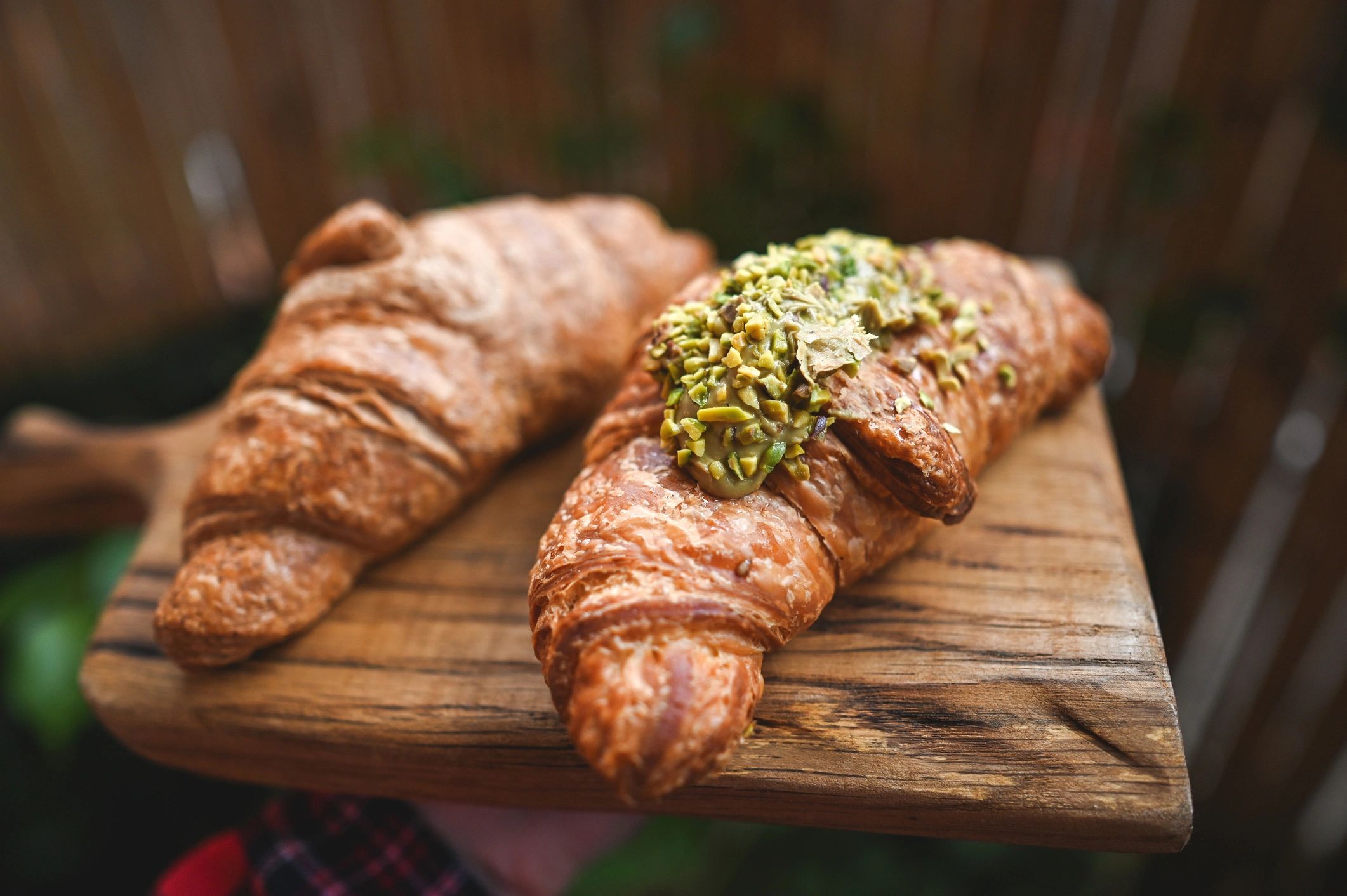 Freshly baked croissants on a tray