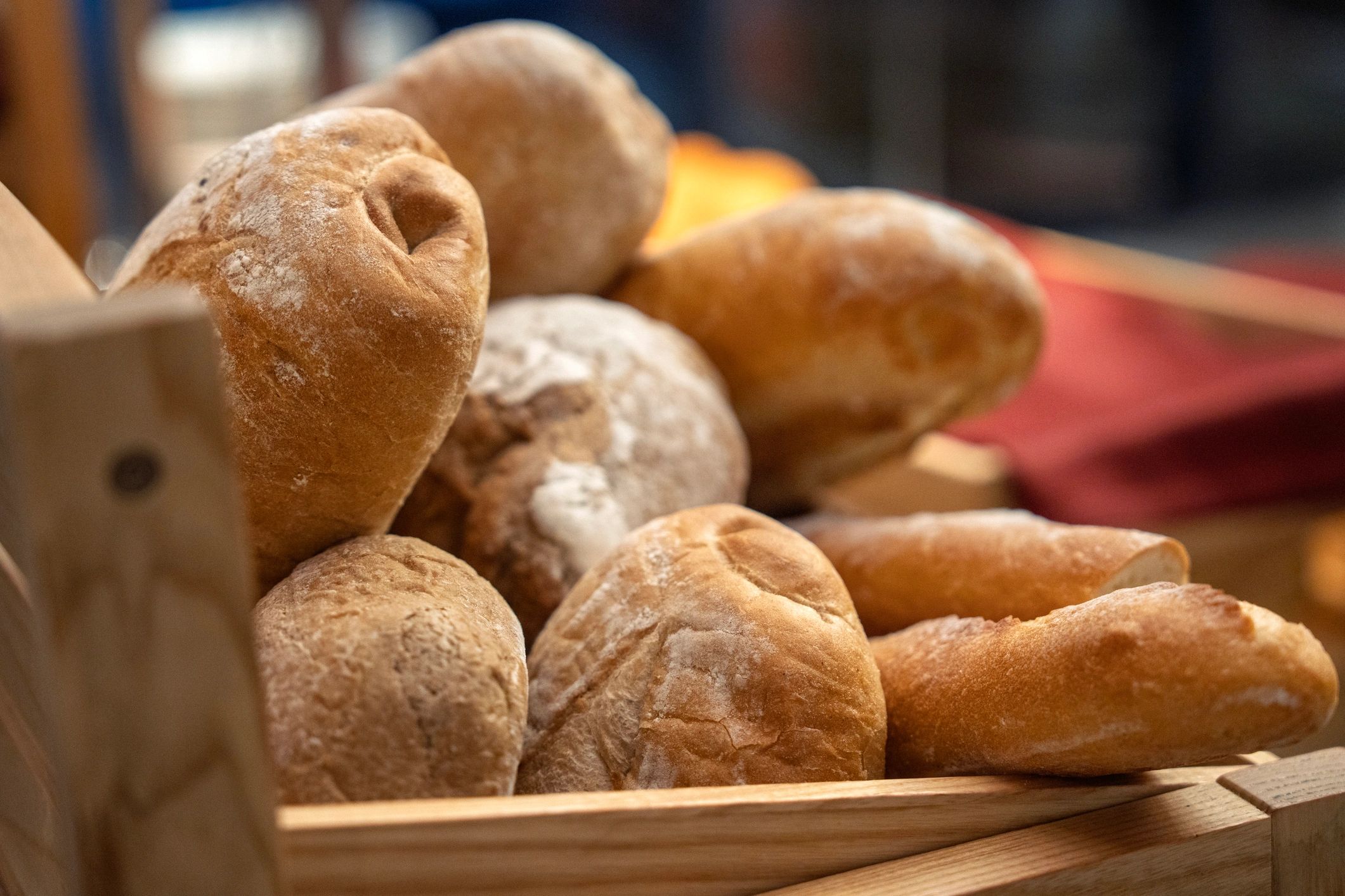 Assorted bread rolls in a wooden basket